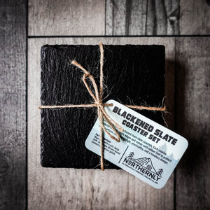 Handcrafted set of 4 blackened riven slate coasters tied with jute twine.